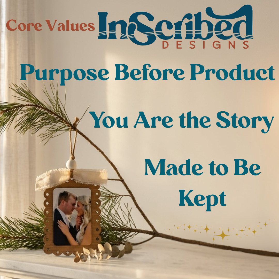 A decorative hanging ornament with a small photo frame and pine branches on a light surface, with large text reading 'Core Values InScribed DESIGNS Purpose Before Product You Are the Story Made to Be Kept.'.