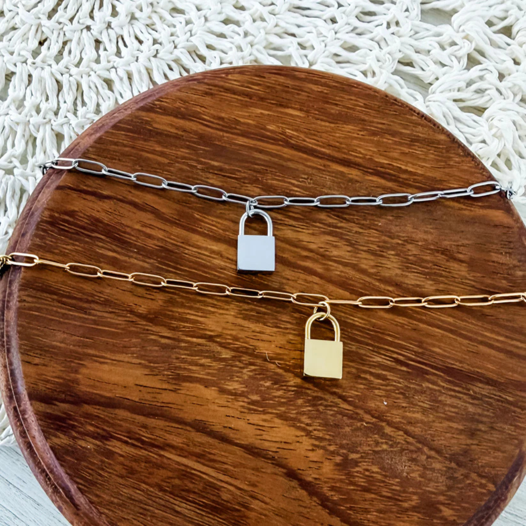 Blank silver and gold lock bracelets for custom personalization.