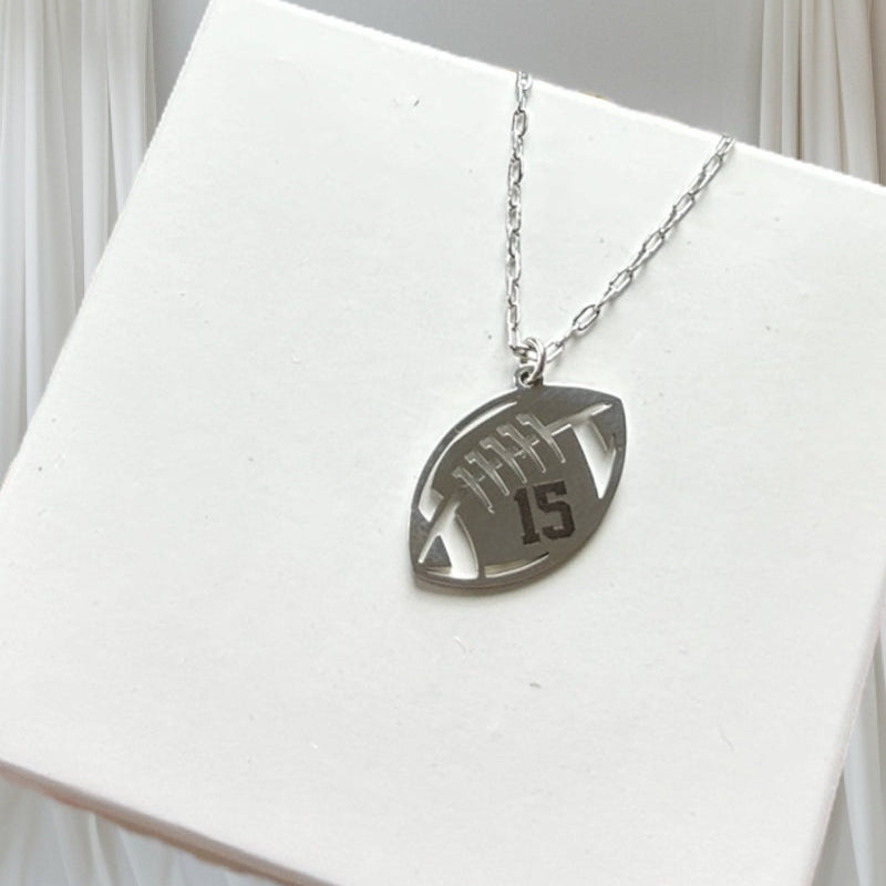 Silver stainless steel engraved necklace on a giftbox.